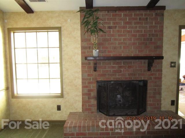 6800 Stoney Ridge Road Matthews, NC 28104 - Photo 8 of 15 a room with a fireplace and a window