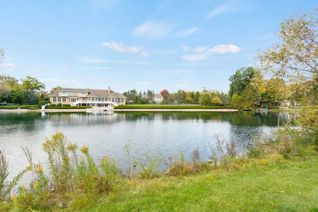 a view of a large body of water with a building in the background
