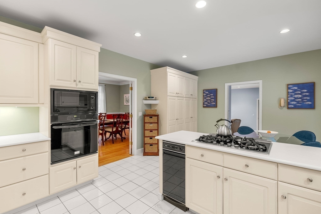 3 Stone Road Boxford, MA 01921 - Photo 12 of 40 a kitchen with stainless steel appliances kitchen island granite countertop a stove and a sink