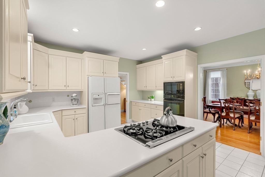 3 Stone Road Boxford, MA 01921 - Photo 14 of 40 a kitchen with stainless steel appliances a stove a sink and a refrigerator