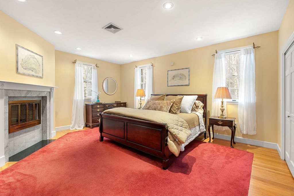 3 Stone Road Boxford, MA 01921 - Photo 20 of 40 a spacious bedroom with a bed and a couch