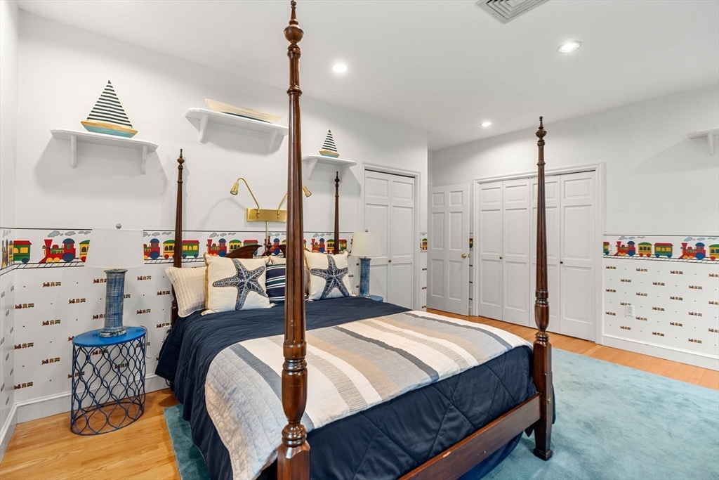 3 Stone Road Boxford, MA 01921 - Photo 23 of 40 a bedroom with furniture a bed and a chandelier