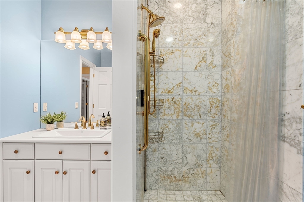 3 Stone Road Boxford, MA 01921 - Photo 24 of 40 a bathroom with a sink vanity and a mirror