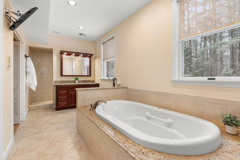 3 Stone Road Boxford, MA 01921 - Photo 25 of 40 a spacious bathroom with a tub double sink and a mirror