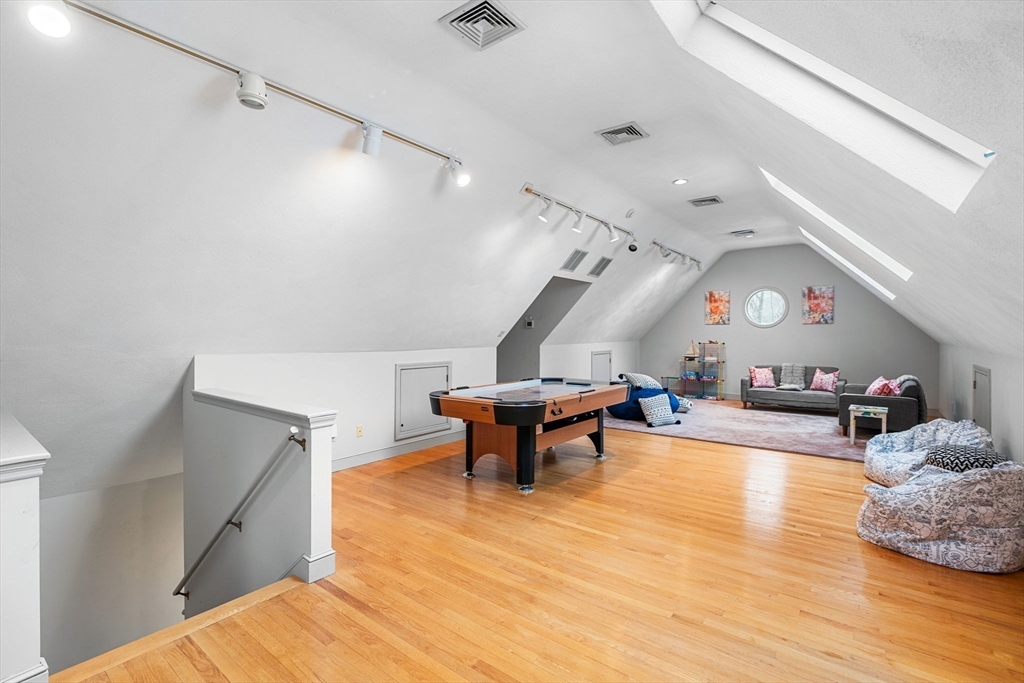 3 Stone Road Boxford, MA 01921 - Photo 28 of 40 a living room with furniture and a wooden floor