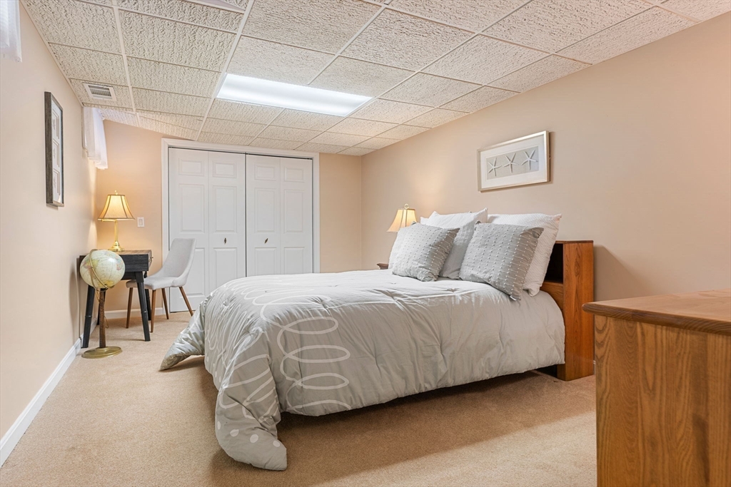 3 Stone Road Boxford, MA 01921 - Photo 31 of 40 a bedroom with a bed and table chair