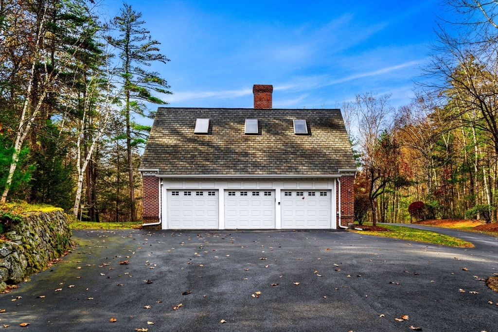 3 Stone Road Boxford, MA 01921 - Photo 33 of 40 a front view of a house with a yard