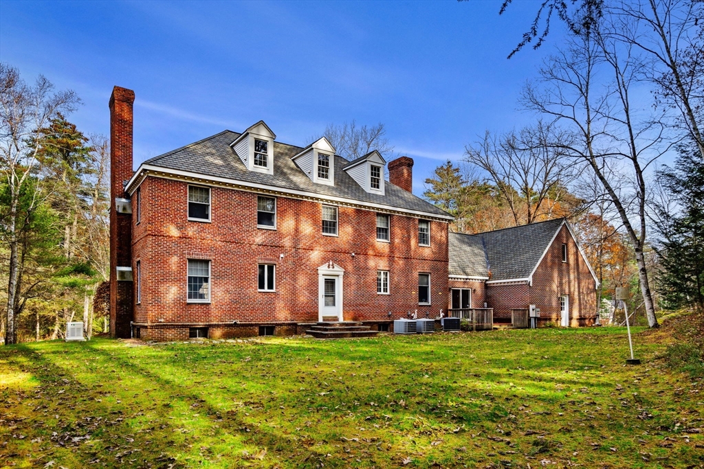 3 Stone Road Boxford, MA 01921 - Photo 35 of 40 a view of a backyard with potted plants and large trees