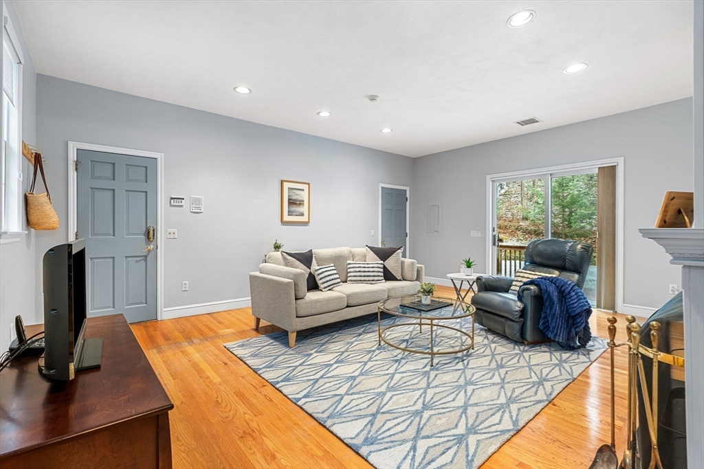 3 Stone Road Boxford, MA 01921 - Photo 6 of 40 a living room with furniture and a flat screen tv