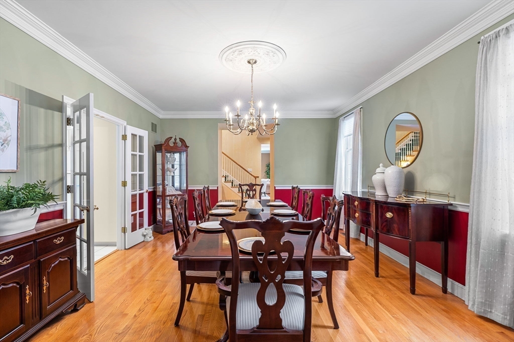 3 Stone Road Boxford, MA 01921 - Photo 9 of 40 a view of a dining room with furniture and chandelier