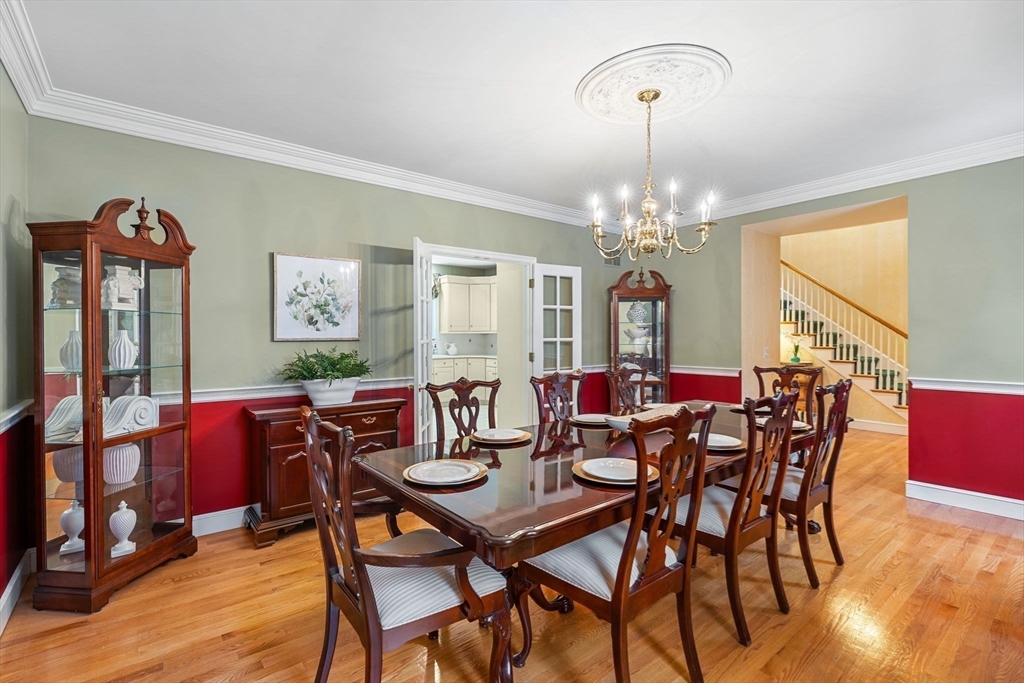 3 Stone Road Boxford, MA 01921 - Photo 10 of 40 a view of a dining room with furniture and chandelier