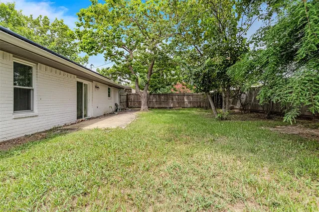 a backyard of a house with lots of green space