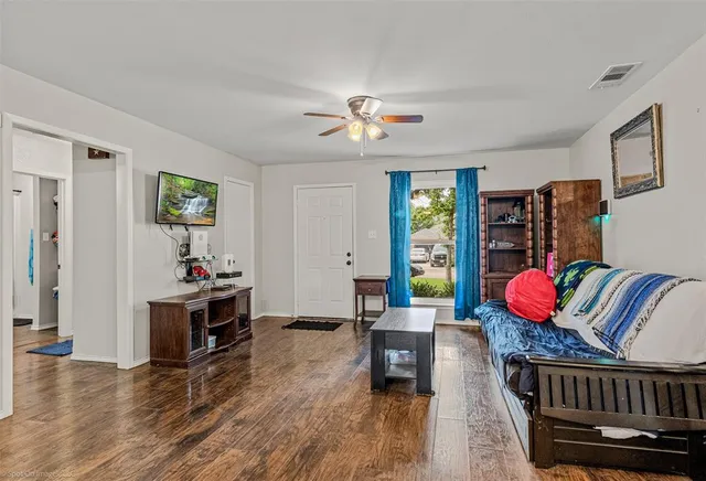 a bedroom with furniture or window and a ceiling fan