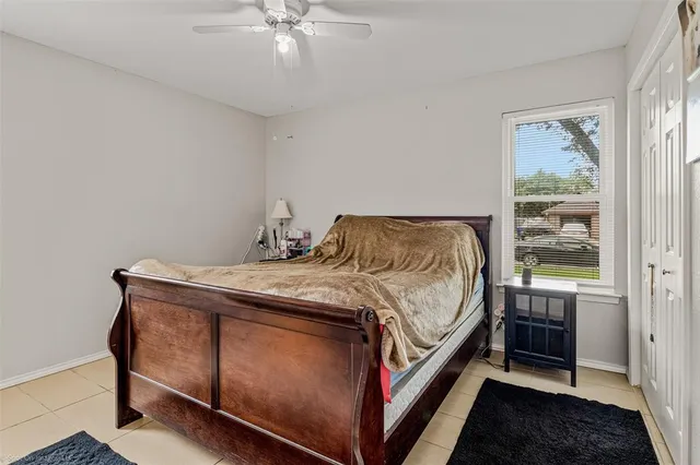 a bedroom with a bed and window