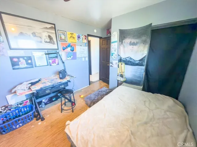 a bedroom with a bed and furniture