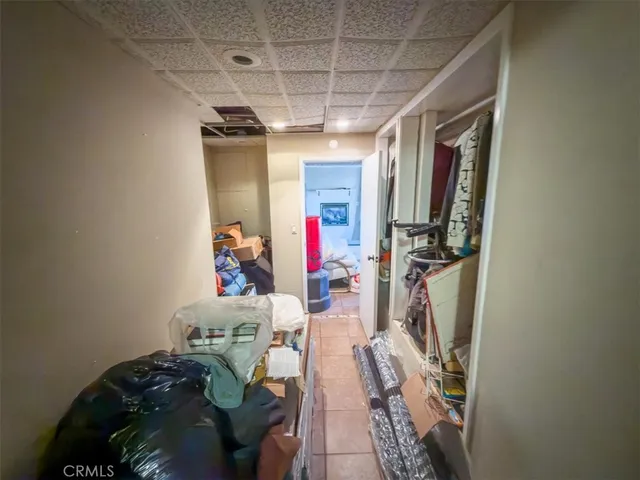 a bedroom with furniture and wooden floor