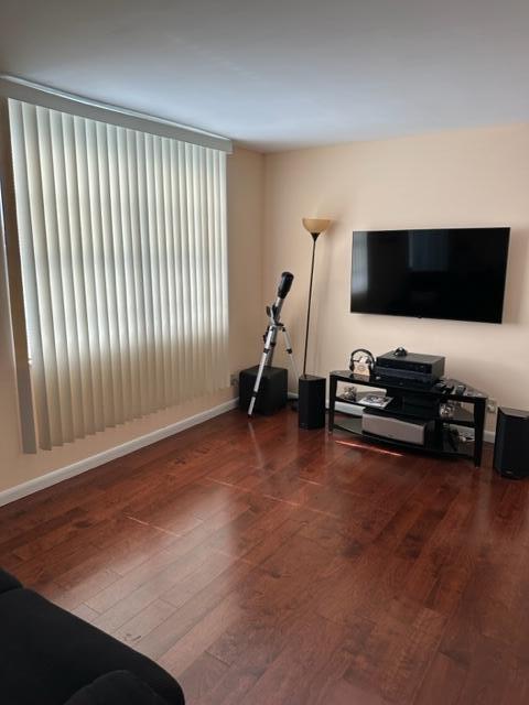 6500 Northwest 2nd Avenue, Unit 512 Boca Raton, FL 33487 - Photo 15 of 41 a living room with furniture and a flat screen tv