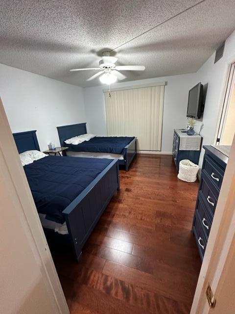 6500 Northwest 2nd Avenue, Unit 512 Boca Raton, FL 33487 - Photo 23 of 41 a spacious bedroom with a bed and a flat tv screen on the dresser