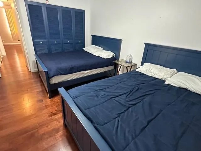 a living room with furniture and a mirror