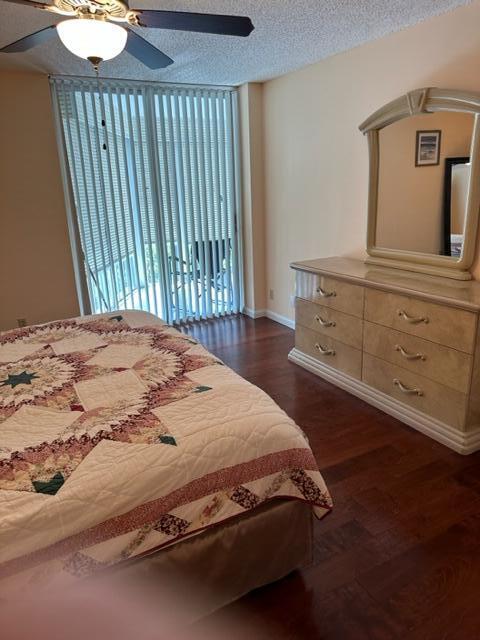 6500 Northwest 2nd Avenue, Unit 512 Boca Raton, FL 33487 - Photo 30 of 41 a bedroom with a bed and a dresser