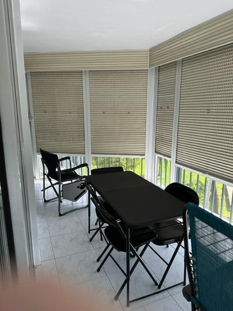 6500 Northwest 2nd Avenue, Unit 512 Boca Raton, FL 33487 - Photo 36 of 41 a backyard of a house with table and chairs