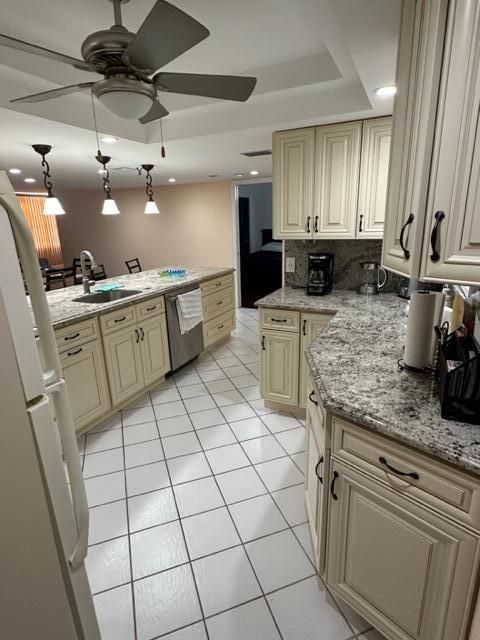 6500 Northwest 2nd Avenue, Unit 512 Boca Raton, FL 33487 - Photo 7 of 41 a kitchen with a sink a stove cabinets and counter space