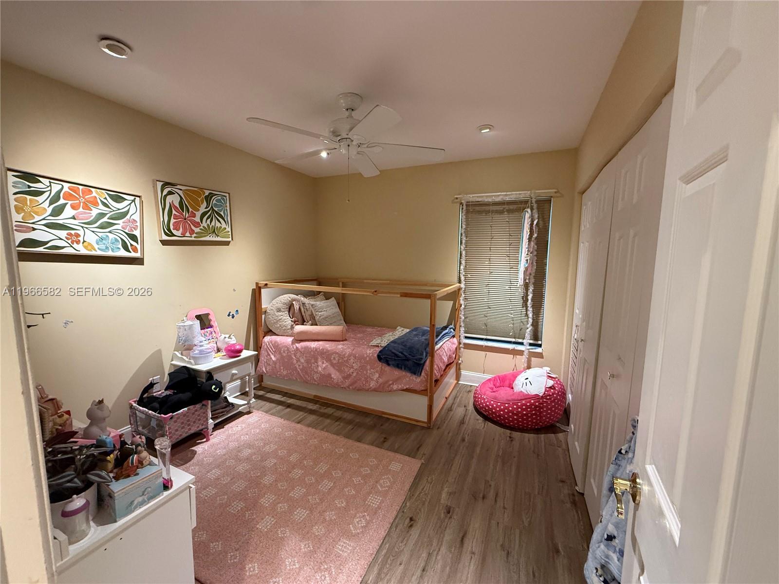 20888 Sugarloaf Lane Boca Raton, FL 33428 - Photo 18 of 25 a bedroom with bed and a chandelier