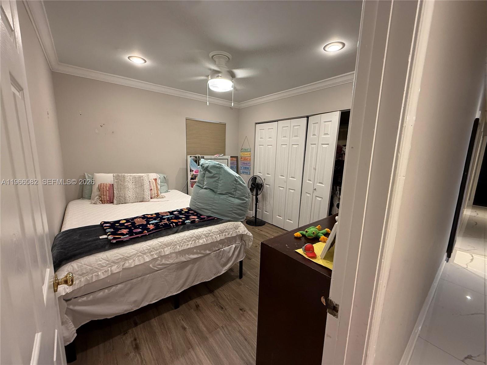 20888 Sugarloaf Lane Boca Raton, FL 33428 - Photo 20 of 25 a bedroom with a bed and a large mirror