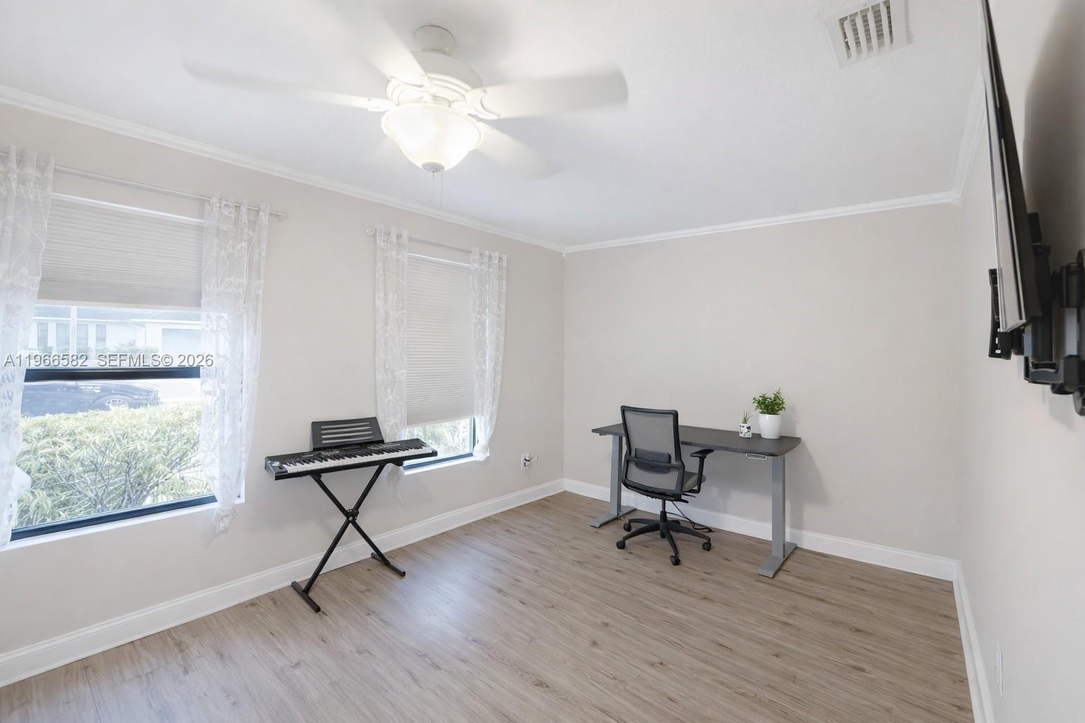 20888 Sugarloaf Lane Boca Raton, FL 33428 - Photo 23 of 25 a view of a workspace with furniture and a window