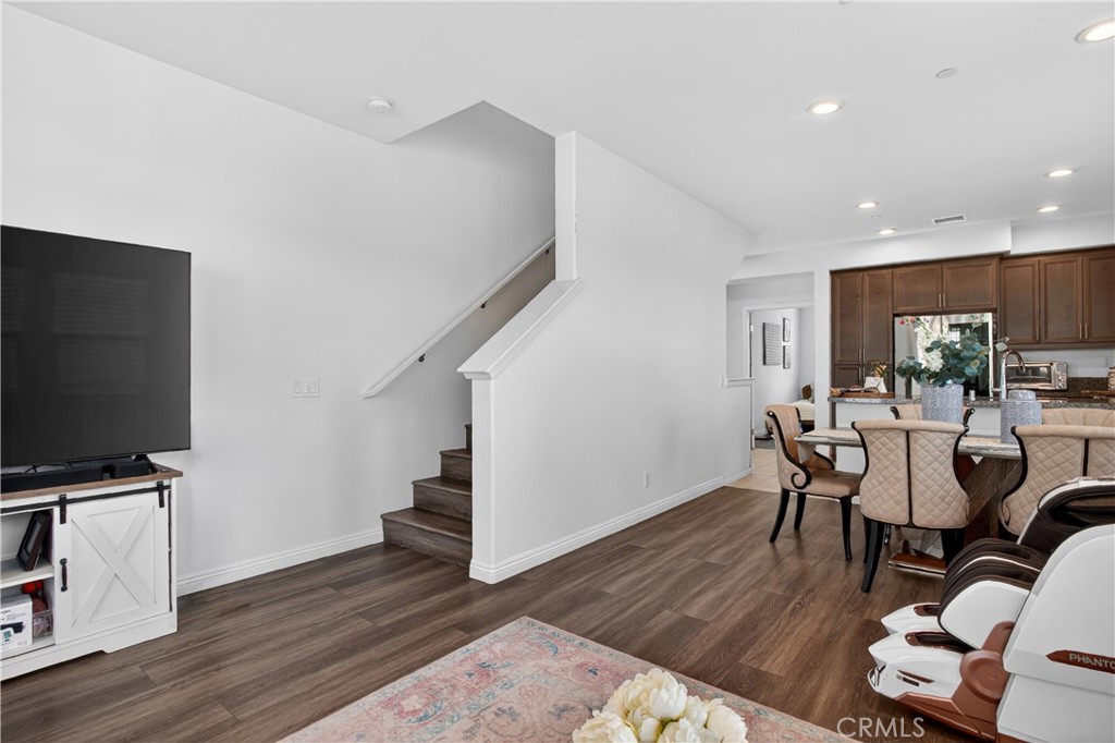5796 Spring Street Buena Park, CA 90621 - Photo 15 of 33 a view of a dining room with furniture and wooden floor