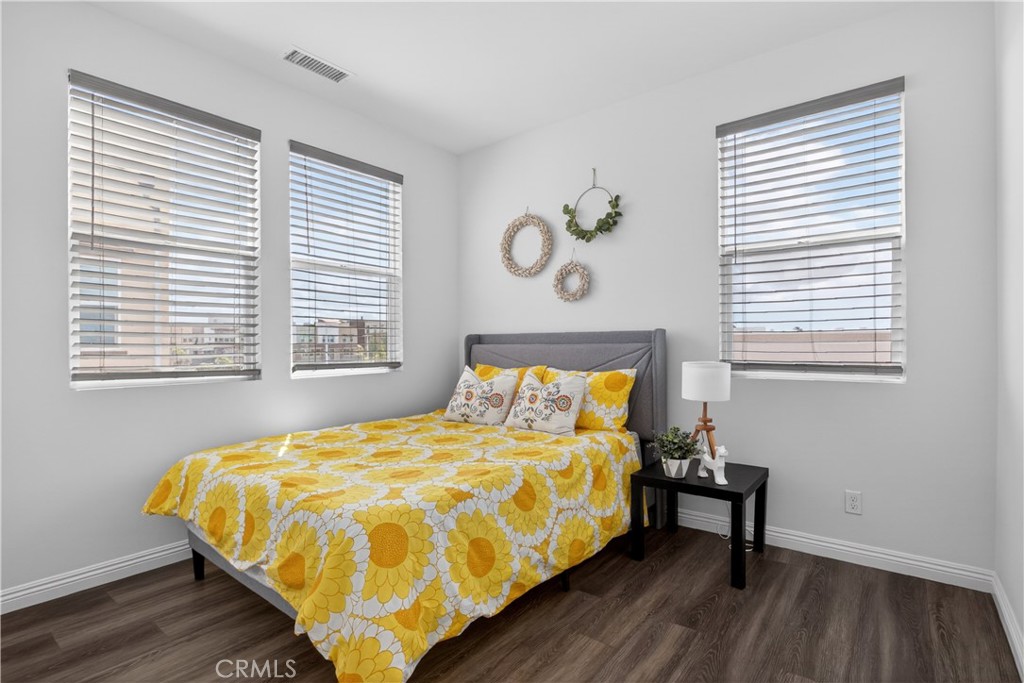 5796 Spring Street Buena Park, CA 90621 - Photo 17 of 33 a bed sitting in a bedroom next to a window