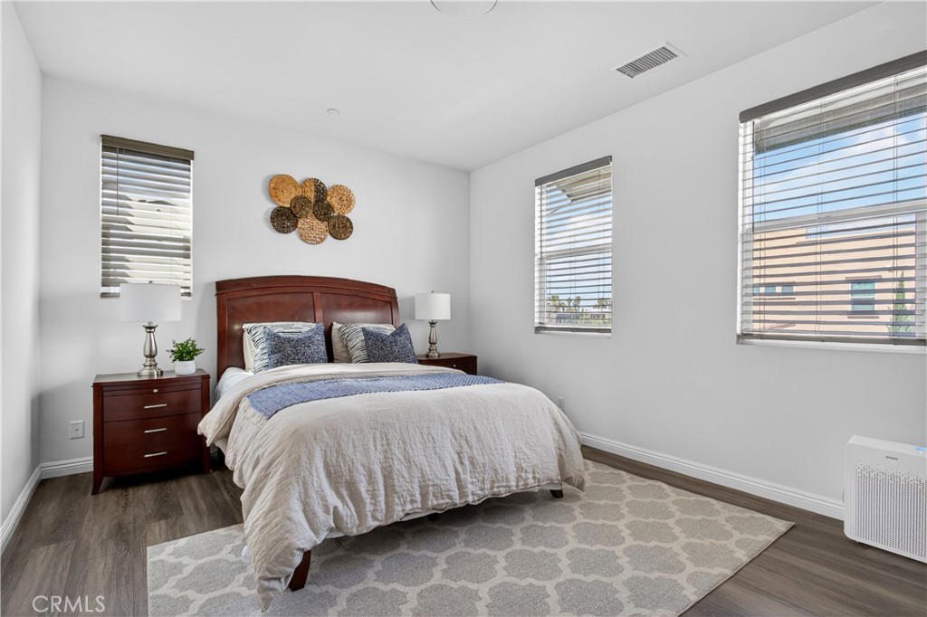 5796 Spring Street Buena Park, CA 90621 - Photo 19 of 33 a bedroom with a bed and a window