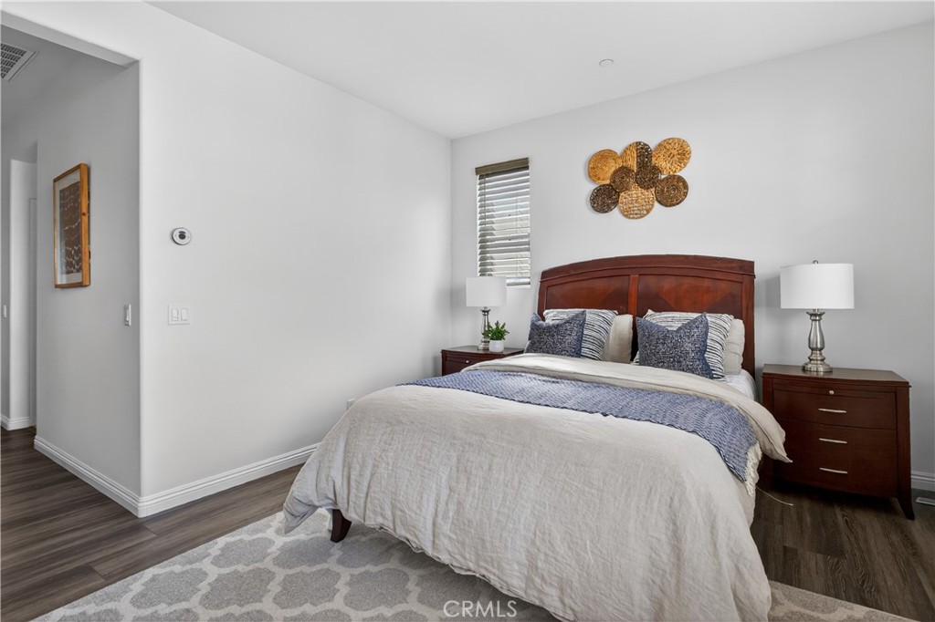 5796 Spring Street Buena Park, CA 90621 - Photo 20 of 33 a bedroom with a bed and painting on the wall