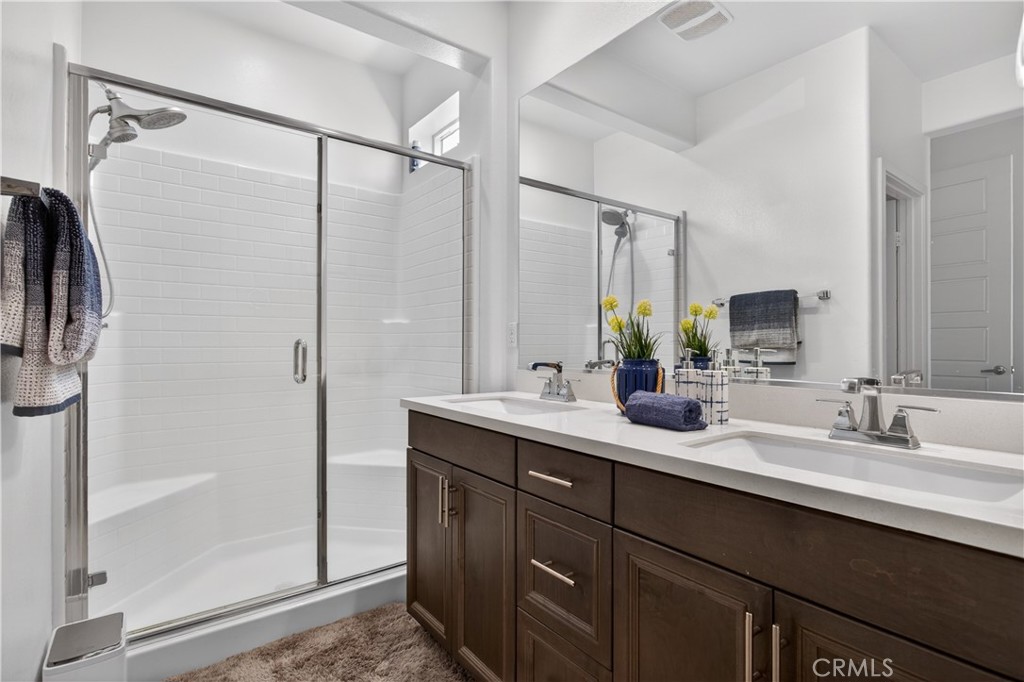 5796 Spring Street Buena Park, CA 90621 - Photo 22 of 33 a bathroom with a double vanity sink mirror and double