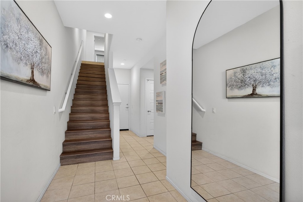5796 Spring Street Buena Park, CA 90621 - Photo 4 of 33 a view of entryway with stairs and wooden floor
