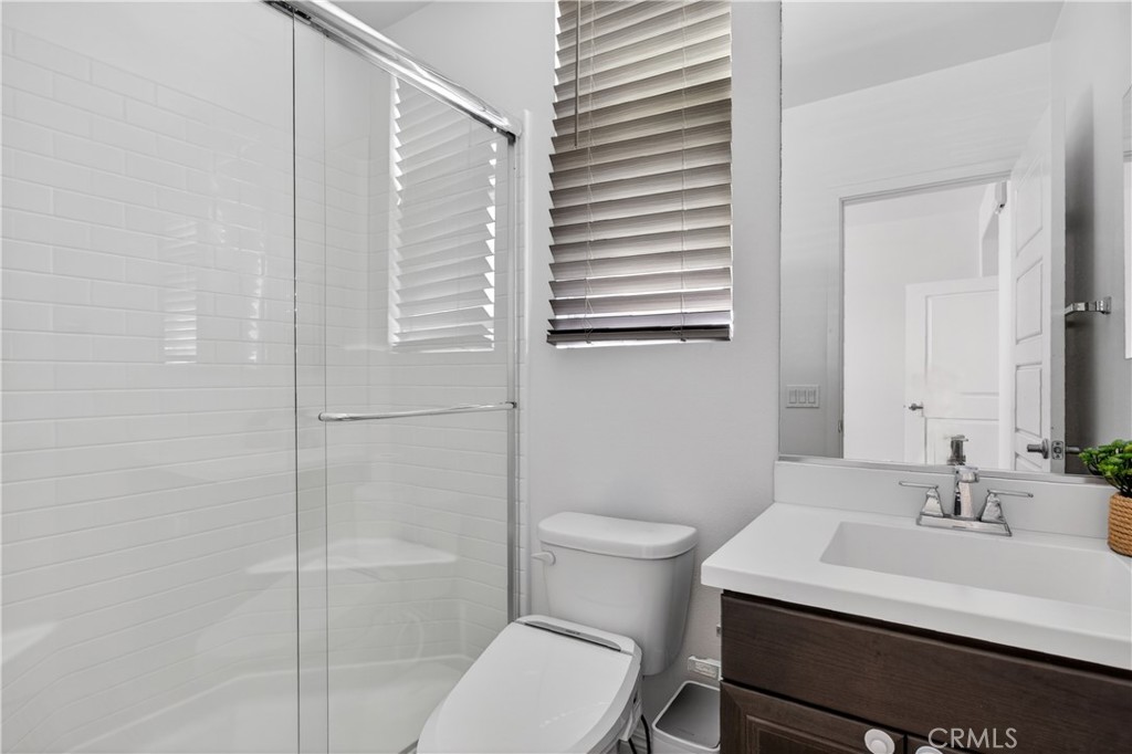 5796 Spring Street Buena Park, CA 90621 - Photo 8 of 33 a bathroom with a sink toilet and shower