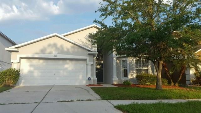 4903 Woodmere Road Land O Lakes, FL 34639 - Photo 1 of 1 a view of backyard of house with green space