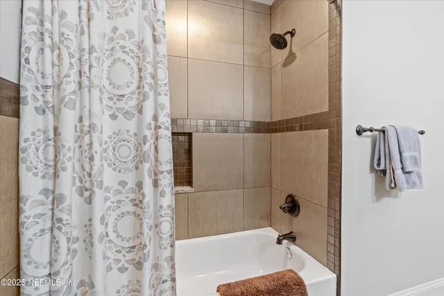 a bathroom with a granite countertop sink a toilet and a mirror