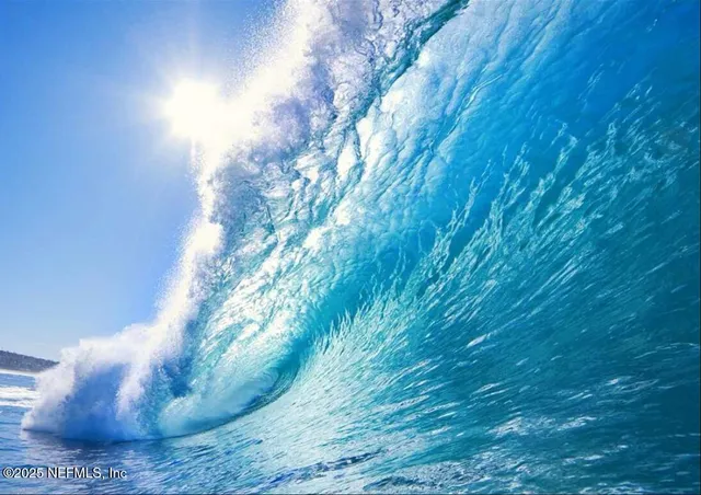 a view of swimming pool with outdoor seating and yard in back