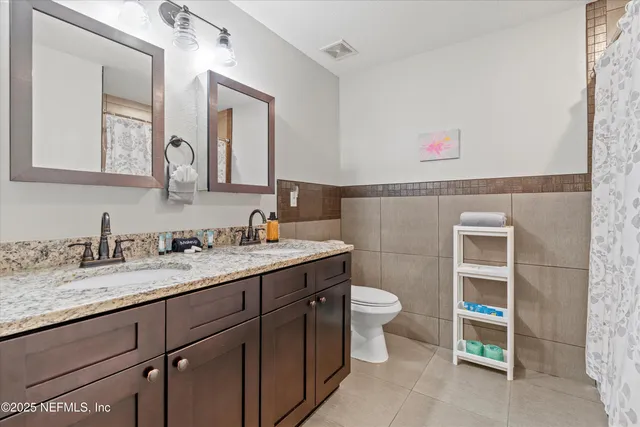 a view of storage and utility room with washer and dryer