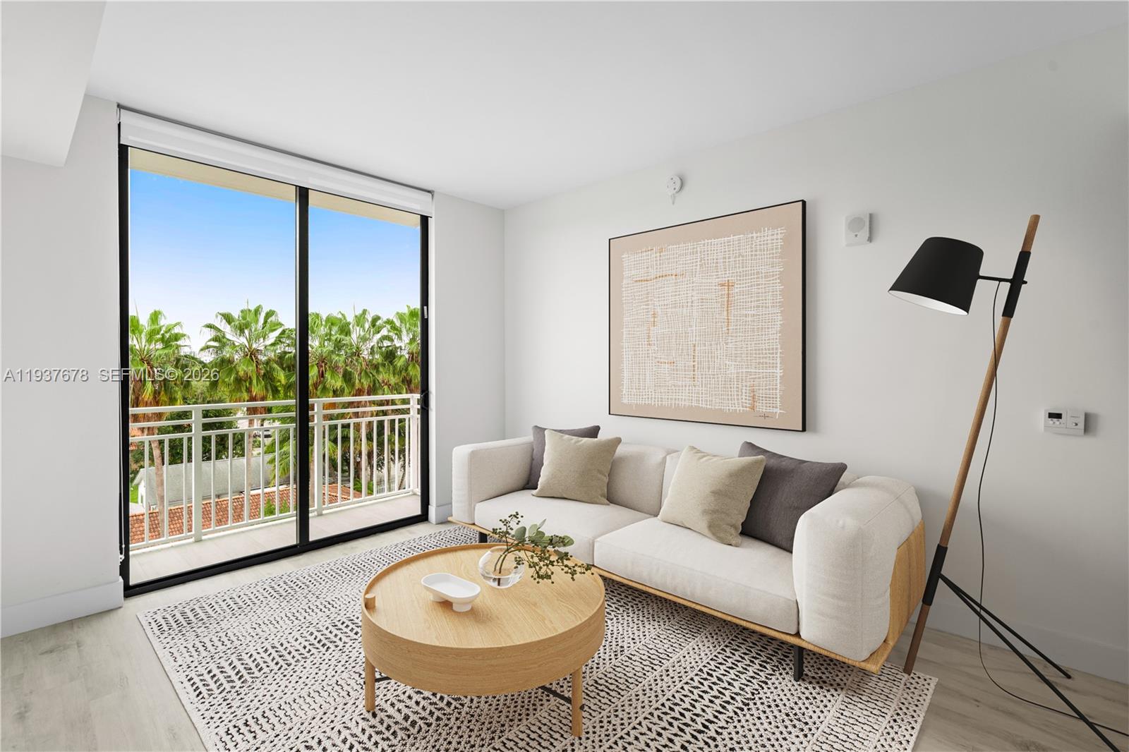 1601 Southwest 32nd Avenue, Unit 514 Miami, FL 33145 - Photo 2 of 5 a living room with furniture and a window