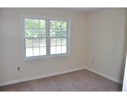 1288 Allen Street Springfield, MA 01118 - Photo 14 of 16 an empty room with wooden floor and windows