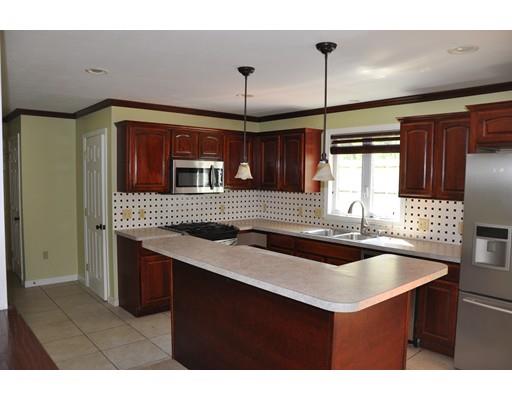 1288 Allen Street Springfield, MA 01118 - Photo 8 of 16 a kitchen with a sink refrigerator and cabinets
