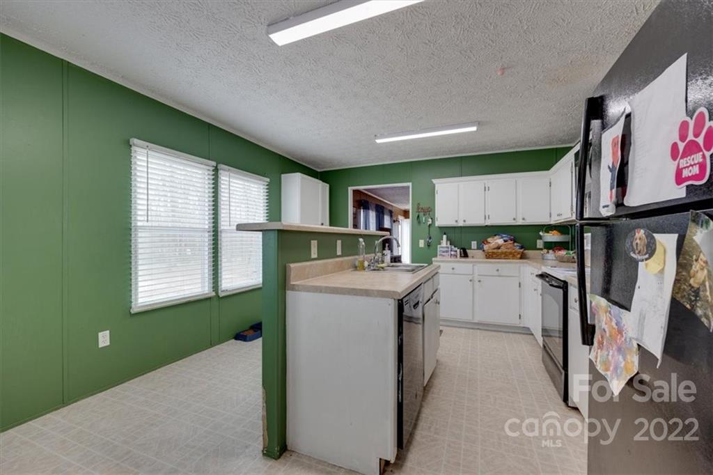 2444 Campbell Lake Road Lancaster, SC 29720 - Photo 13 of 24 a kitchen with refrigerator and window