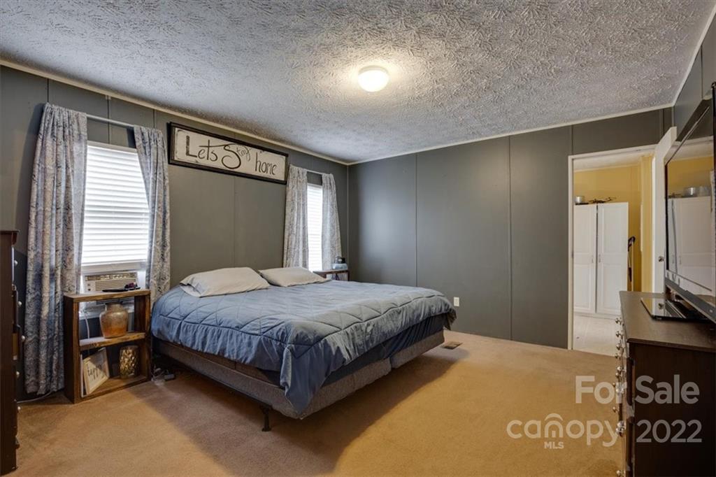 2444 Campbell Lake Road Lancaster, SC 29720 - Photo 14 of 24 a bedroom with a bed and a television