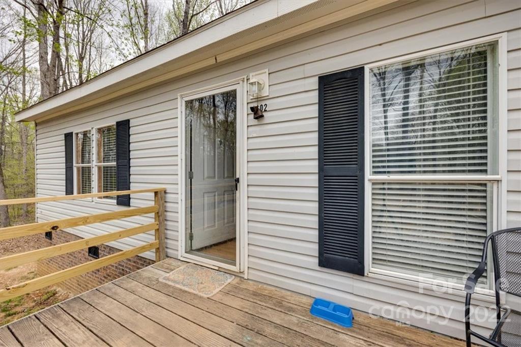 2444 Campbell Lake Road Lancaster, SC 29720 - Photo 2 of 24 a view of a terrace with a white door and wooden floor