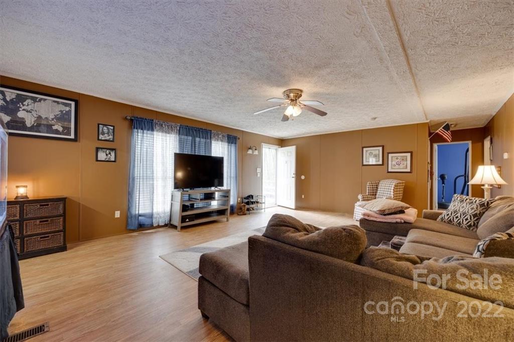 2444 Campbell Lake Road Lancaster, SC 29720 - Photo 7 of 24 a living room with furniture and a flat screen tv