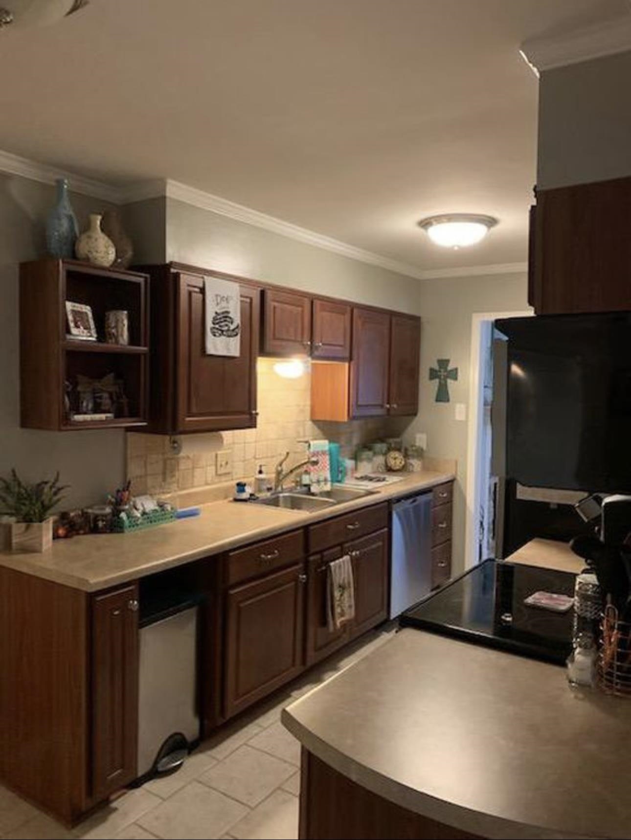1659 Delmont Road Memphis, TN 38117 - Photo 3 of 12 a kitchen with a sink and a stove top oven with wooden floor
