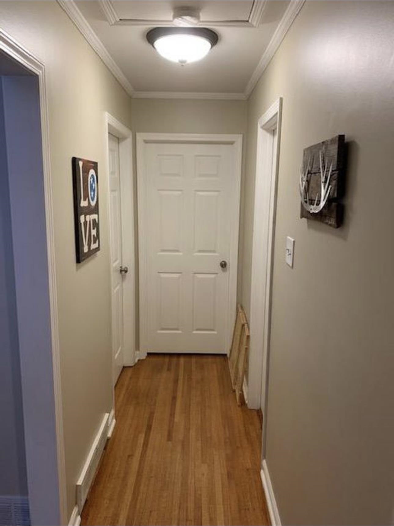 1659 Delmont Road Memphis, TN 38117 - Photo 7 of 12 a view of a hallway with wooden floor and closet