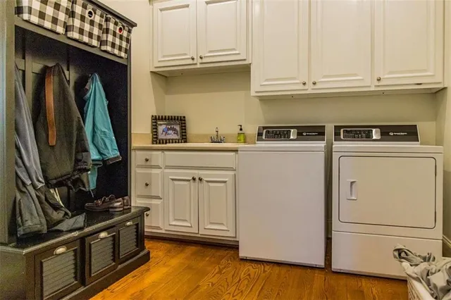 a kitchen with stainless steel appliances granite countertop a refrigerator and a stove